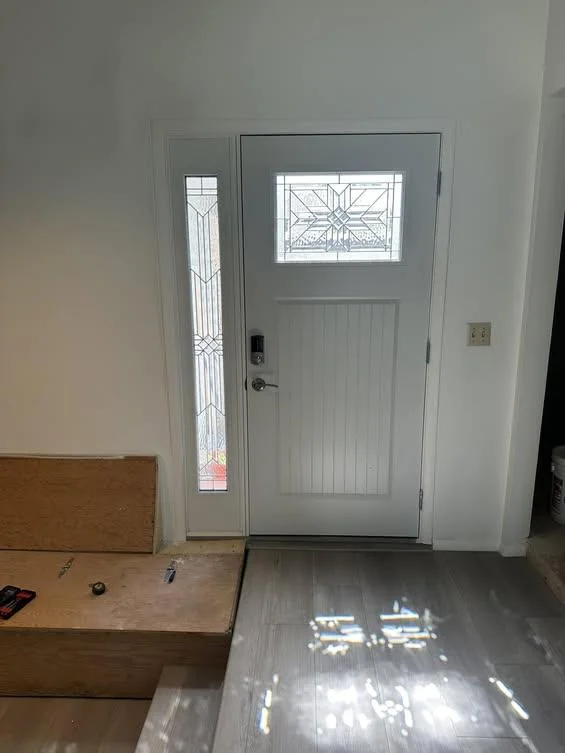 Entryway and front door shown in a Pro Build Services Facebook project photo